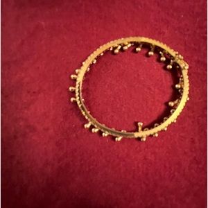 What a unique bracelet, Gold tone with hanging Gold, danglers, and crystals